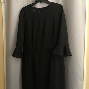Black,  bell-sleeved, dress.